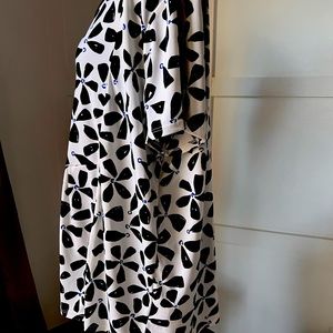 Floral patterned black and white blouse.